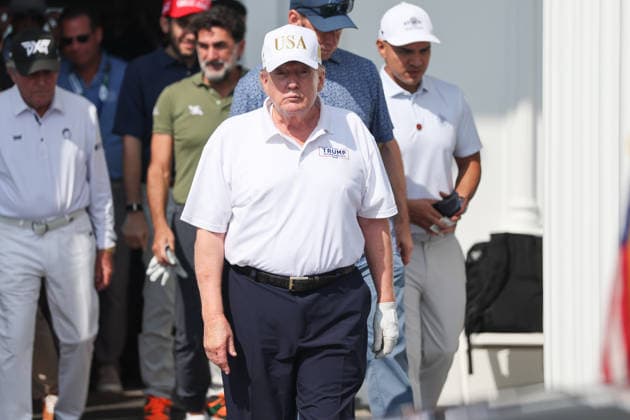 BEDMINSTER, NJ - AUGUST 09: President Donald Trump walks out of the clubhouse at Bedminster before the forth round of LIV Golf New York on August 9, 2026 at Trump National Golf Club in Bedminster, New Jersey. (Photo by Andrew Mordzynski Icon Sportswire) GOLF: AUG 09 LIV Golf New York EDITORIAL USE ONLY Icon2608098162825