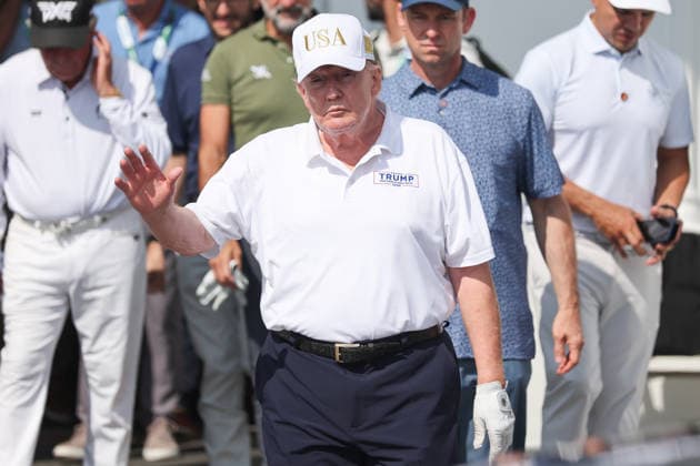BEDMINSTER, NJ - AUGUST 09: President Donald Trump walks out of the clubhouse at Bedminster before the forth round of LIV Golf New York on August 9, 2026 at Trump National Golf Club in Bedminster, New Jersey. (Photo by Andrew Mordzynski Icon Sportswire) GOLF: AUG 09 LIV Golf New York EDITORIAL USE ONLY Icon2608098162826