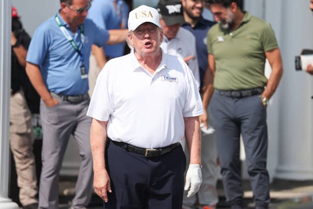 BEDMINSTER, NJ - AUGUST 09: President Donald Trump walks out of the clubhouse at Bedminster before the forth round of LIV Golf New York on August 9, 2026 at Trump National Golf Club in Bedminster, New Jersey. (Photo by Andrew Mordzynski Icon Sportswire) GOLF: AUG 09 LIV Golf New York EDITORIAL USE ONLY Icon2608098162829