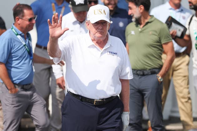 BEDMINSTER, NJ - AUGUST 09: President Donald Trump walks out of the clubhouse at Bedminster before the forth round of LIV Golf New York on August 9, 2026 at Trump National Golf Club in Bedminster, New Jersey. (Photo by Andrew Mordzynski Icon Sportswire) GOLF: AUG 09 LIV Golf New York EDITORIAL USE ONLY Icon2608098162840