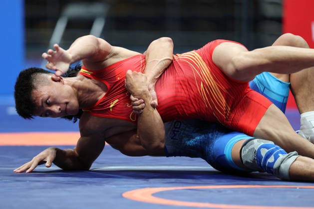 (260809) -- XI AN, Aug. 9, 2026 -- Munkh-erdene Batkhuyag of Mongolia and Bai Jiliang (front) of China compete during the men s freestyle 57kg final at 2026 China-Central Asia Elite Wrestling Tournament in Xi an, northwest China s Shaanxi Province, Aug. 9, 2026. ) (SP)CHINA-XI AN-WRESTLING-2026 CHINA-CENTRAL ASIA ELITE WRESTLING TOURNAMENT (CN) LixYibo 