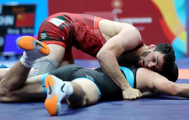 (260809) -- XI AN, Aug. 9, 2026 -- Magomet Evloev (top) of Tajikistan and Gang Suhe of China compete during the men s freestyle 86kg final at 2026 China-Central Asia Elite Wrestling Tournament in Xi an, northwest China s Shaanxi Province, Aug. 9, 2026. ) (SP)CHINA-XI AN-WRESTLING-2026 CHINA-CENTRAL ASIA ELITE WRESTLING TOURNAMENT (CN) LixYibo 