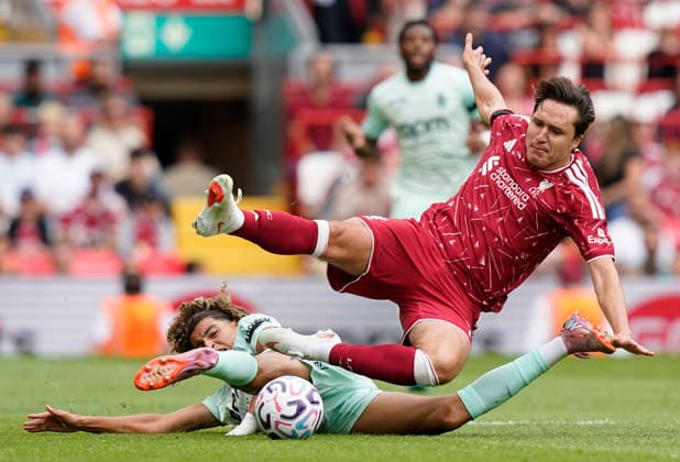 Liverpool, England, 9th August 2026. Federico Chiesa of Liverpool (R) is challenged by Anis Soubeir of Monaco during the Liverpool vs AS Monaco Pre Season Friendly match at Anfield, Liverpool. Picture credit should read: Andrew Yates Sportimage EDITORIAL USE ONLY. No use with unauthorised audio, video, data, fixture lists, club league logos or live services. Online in-match use limited to 120 images, no video emulation. No use in betting, games or single club league player publications. SPI_022_AY_LIVERPOOL_MONACO SPI-4893-0017