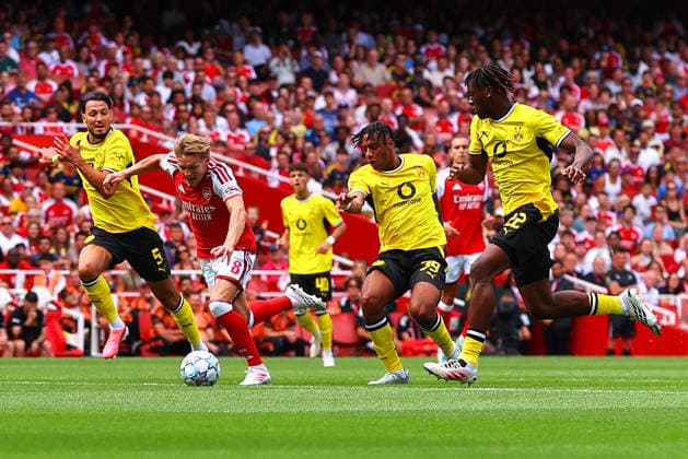 Martin Odegaard of Arsenal is fouled by Filippo Mane of Borussia Dortmund during the pre-season friendly match between Arsenal FC and Borussia Dortmund at Emirates Stadium on August 9, 2026 in London, England. (Photo by Ryan Crockett DeFodi Images) - *** Martin Odegaard of Arsenal is fouled by Filippo Mane of Borussia Dortmund during the preseason friendly match between Arsenal FC and Borussia Dortmund at Emirates Stadium on August 9, 2026, in London, England. Photo by Ryan Crockett, DeFodi Images
