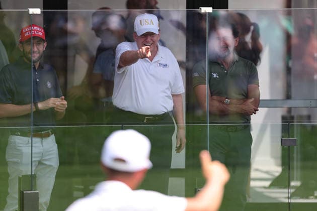 BEDMINSTER, NJ - AUGUST 09: President Donald Trump points to golfers at his golf course at Bedminster during the forth round of LIV Golf New York on August 9, 2026 at Trump National Golf Club in Bedminster, New Jersey. (Photo by Andrew Mordzynski Icon Sportswire) GOLF: AUG 09 LIV Golf New York EDITORIAL USE ONLY Icon2608098173334