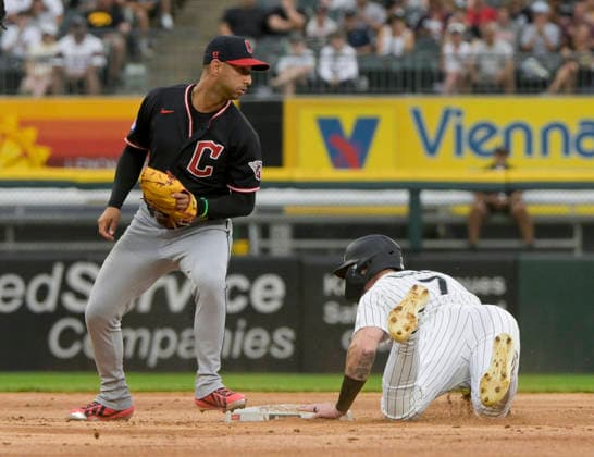Cleveland Guardians shortstop Brayan Rocchio (4) comes up short on the tag of Chicago White Sox Brenton Doyle (7) during the first inning at Rate Field in Chicago, IL on Sunday, August 9, 2026.  CHI20260809110 MARKxBLACK
