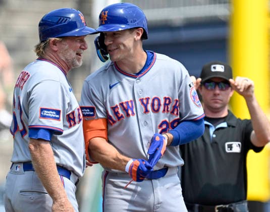 New York Mets first baseman Jared Young (29) celebrates his triple in third inning against the Pittsburgh Pirates with New York Mets third base coach Tim Leiper (63) at PNC Park on Sunday, August 9, 2026 in Pittsburgh.  PIT2026080914 ArchiexCarpenter