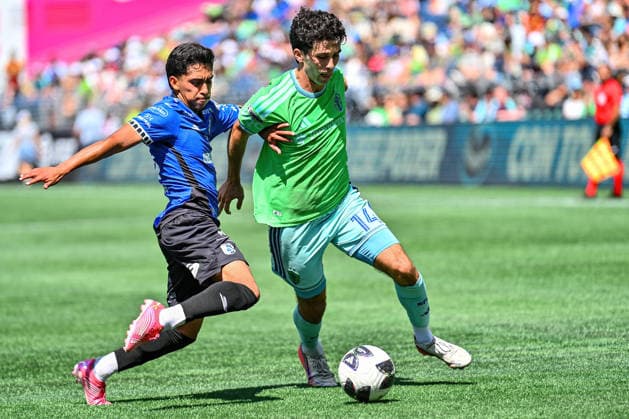 July 25, 2026: Seattle Sounders FC Forward Paul Miles Rothrock (14) drives the ball towards the goal, as Queretaro Midfielder Erik DueoÂ±as Vallejo (18) comes in to make a stop during the Leagues Cup match between Seattle Sounders FC and Quero taro in Seattle, WA. the Sounders defeated Quero taro 3-0. CSM Seattle United States - ZUMAc04_ 20260809_zma_c04_038 Copyright: xStevexFaberx