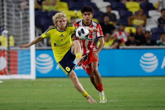 NASHVILLE, TN - AUGUST 09: Nashville SC midfielder Edvard Tagseth (20) receives a pass in front of AtlŽtico San Luis midfielder Miguel Garc’a (14) during a LeagueÕs Cup match between Nashville SC and AtlŽtico San Luis, August 9, 2026, at GEODIS Park in Nashville, Tennessee. (Photo by Matthew Maxey Icon Sportswire) SOCCER: AUG 09 Leagues Cup Nashville vs Atletico de San Luis EDITORIAL USE ONLY Icon26080935