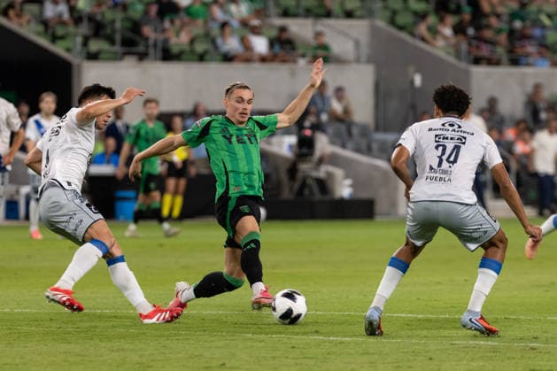 AUSTIN, TX - AUGUST 09: Forward Przemyslaw Placheta 77 of the Austin FC stretches out to control the ball between Puebla defenders during the Leagues Cup match between Austin FC and Club Puebla on August 9, 2026, at Q2 Stadium in Austin, TX. (Photo by David Buono Icon Sportswire) SOCCER: AUG 09 Leagues Cup Austin vs Puebla EDITORIAL USE ONLY Icon260809024