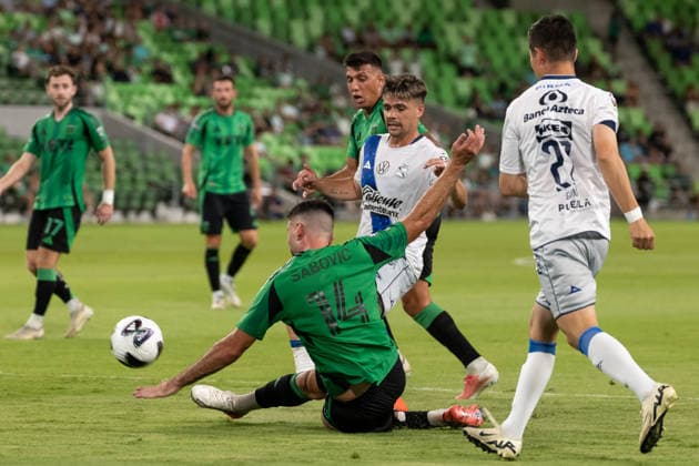 AUSTIN, TX - AUGUST 09: Midfielder Besard Sabovic 14 of the Austin FC attempts to kick the ball as he falls to the pitch during the Leagues Cup match between Austin FC and Club Puebla on August 9, 2026, at Q2 Stadium in Austin, TX. (Photo by David Buono Icon Sportswire) SOCCER: AUG 09 Leagues Cup Austin vs Puebla EDITORIAL USE ONLY Icon260809039