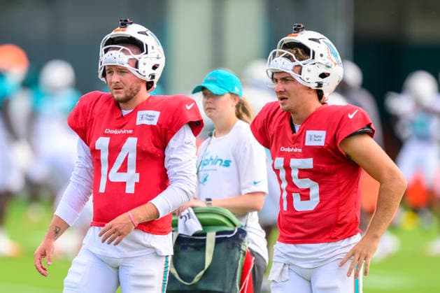 MIAMI GARDENS, FL - AUGUST 10: Miami Dolphins quarterback Quinn Ewers (14) and quarterback Cam Miller (15) stand on the field during the Miami Dolphins Training Camp on August 10 2026, at the Baptist Health Training Complex in Miami Gardens, FL. (Photo by Doug Murray Icon Sportswire) NFL, American Football Herren, USA AUG 10 Dolphins Training Camp EDITORIAL USE ONLY Icon796260810016
