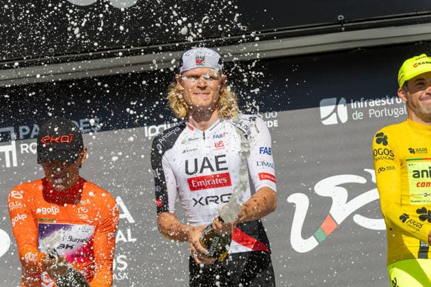 5th Stage Podium At The 87th Volta A Portugal Danish cyclist Julius Johansen of UAE Team Emirates-XRG celebrates on the podium after winning the fifth stage of the 87th Volta a Portugal, an individual time trial from Anadia to Agueda, Portugal, on August 10, 2026. Agueda Portugal  Copyright: xEduardoxAlmeidax originalFilename:almeida-juliusjo260810_npuAd.jpg