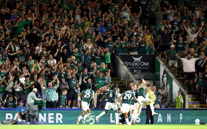 Plymouth Argyle fans celebrate the opening goal scored by Alex Hartridge Plymouth Argyle v Exeter City, EFL Carabao Cup, First Round, Football, Home Park, Plymouth, UK - 10 Aug 2026Plymouth Home Park United Kingdom EDITORIAL USE ONLY No use with unauthorised audio, video, data, fixture lists, club league logos or live services. Online in-match use limited to 120 images, no video emulation. No use in betting, games or single club league player publications.  Copyright: xKieranxMcManus Shutterstockx 17061087by