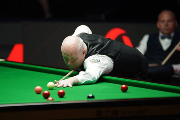 TAIYUAN, CHINA - AUGUST 11: John Higgins of Scotland plays a shot in the first round match against Stuart Bingham of England on day 4 of the 2026 World Snooker Tour China Open at Taiyuan Binhe Sports Center on August 11, 2026 in Taiyuan, Shanxi Province of China.  Copyright: xTaixChengzhex 111659329893
