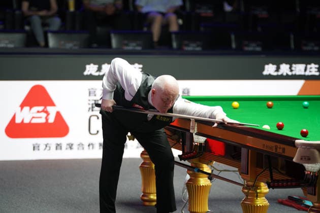 TAIYUAN, CHINA - AUGUST 11: John Higgins of Scotland plays a shot in the first round match against Stuart Bingham of England on day 4 of the 2026 World Snooker Tour China Open at Taiyuan Binhe Sports Center on August 11, 2026 in Taiyuan, Shanxi Province of China.  Copyright: xTaixChengzhex 111659329895