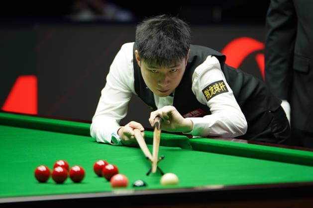 TAIYUAN, CHINA - AUGUST 11: Zhao Xintong of China plays a shot during his first round match against Zhang Anda of China at the Snooker China Open 2026 on August 11, 2026 in Taiyuan, Shanxi Province of China. The tournament features top snooker players competing for the championship title.  Copyright: xTaixChengzhex 111659394923