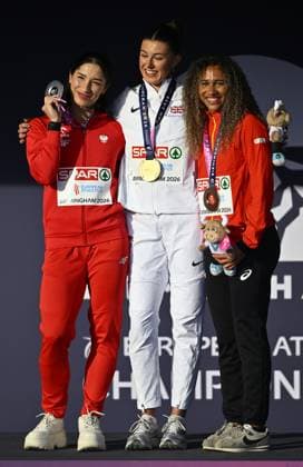 Poland s Ewa Swoboda , winner of the silver medal; Great Britain s Amy Hunt , winner of the gold medal and Belgian Delphine Nkansa , winner of the bronze medal pictured on the podium of the 100m event on the second day of the European Athletics Championships (August 10-18) in Birmingham, United Kingdom, on Tuesday 11 August 2026. ERICxLALMAND  x183180560x