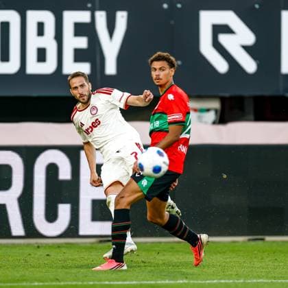 NIJMEGEN , 08-07-2026 , Stadium De Goffert , season 2026 2027 , Third qualifying round UEFA Champions League 2nd leg football , match between NEC Nijmegen and Olympiacos , picture shows Olympiacos player Kostas Fortounis and NEC player Deveron Fonville NEC - Olympiacos  x205634293x Copyright: