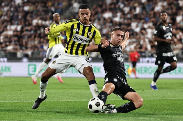 SOCCER - UEFA CL, Sturm vs Fenerbahce GRAZ,AUSTRIA,11.AUG.26 - SOCCER - UEFA Champions League, qualification, SK Sturm Graz vs Fenerbahce Istanbul. Image shows Mason Greenwood (Fenerbahce) and Petar Petrovic (Sturm).  GEPAxpictures xChrisxBauer