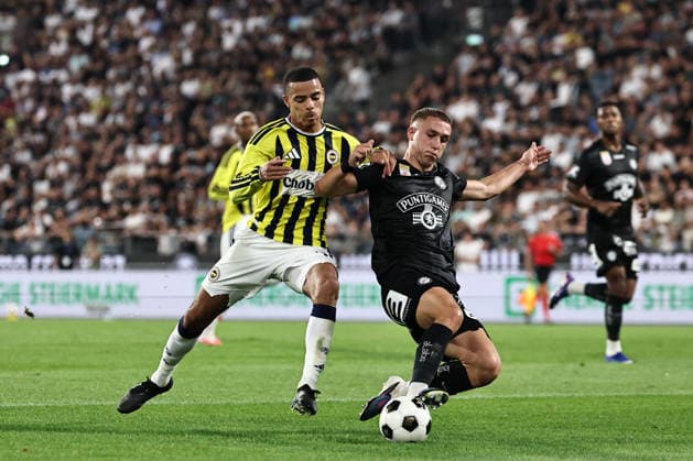 SOCCER - UEFA CL, Sturm vs Fenerbahce GRAZ,AUSTRIA,11.AUG.26 - SOCCER - UEFA Champions League, qualification, SK Sturm Graz vs Fenerbahce Istanbul. Image shows Mason Greenwood (Fenerbahce) and Petar Petrovic (Sturm).  GEPAxpictures xChrisxBauer