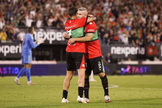 NIJMEGEN - Emre Mor of NEC Nijmegen (l) receives congratulations from Bryan Linssen of NEC Nijmegen after scoring the 2-1 goal during the 3rd Champions League qualifying round between NEC and Olympiakos Piraeus at De Goffert on August 11, 2026 in Nijmegen, the Netherlands. BART STOUTJESDIJK ANP UEFA Champion League Third qualifying round 2nd leg 2026-2027 xVIxANPxSportx xxANPxIVx 565283907 originalFilename: 565283907.jpg