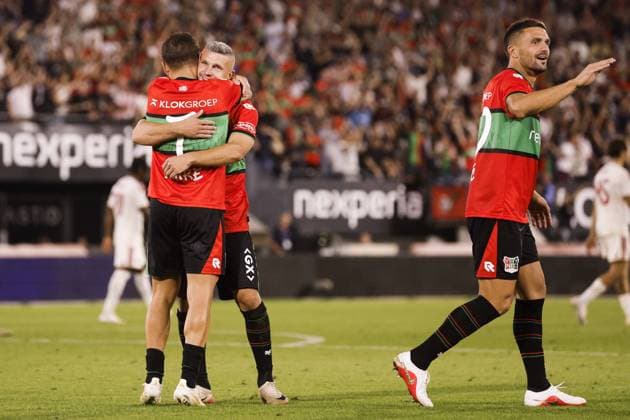 NIJMEGEN - Emre Mor of NEC Nijmegen (l) receives congratulations from Bryan Linssen of NEC Nijmegen (m), DuÅ¡an TadiÄ‡ of NEC Nijmegen after scoring the 2-1 goal during the 3rd qualifying round of the Champions League between NEC and Olympiakos Piraeus at De Goffert on August 11, 2026 in Nijmegen, the Netherlands. BART STOUTJESDIJK ANP UEFA Champion League Third qualifying round 2nd leg 2026-2027 xVIxANPxSportx xxANPxIVx 565283958 originalFilename: 565283958.jpg