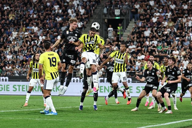 SOCCER - UEFA CL, Sturm vs Fenerbahce GRAZ,AUSTRIA,11.AUG.26 - SOCCER - UEFA Champions League, qualification, SK Sturm Graz vs Fenerbahce Istanbul. Image shows Nelson Weiper (Sturm) and Mert Muelduer (Fenerbahce).  GEPAxpictures xChrisxBauer