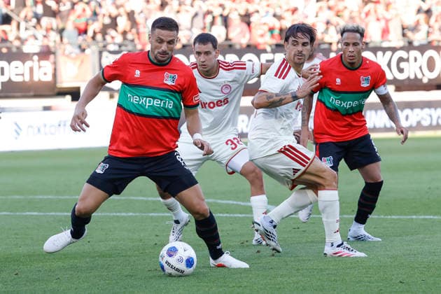 2026-08-11 NEC Nijmegen v Olympiacos - Champions League qualifying phase NIJMEGEN, NETHERLANDS - AUGUST 11: Dusan Tadic of NEC Nijmegen, Santiago Hezze of Olympiakos Piraeus, Panagiotis Retsos of Olympiakos Piraeus, Tjaronn Chery of NEC Nijmegen during the Champions League qualifying phase match between NEC Nijmegen and Olympiacos at Goffertstadion on August 11, 2026 in Nijmegen, Netherlands. Nijmegen Goffertstadion Netherlands Content not available for redistribution in The Netherlands directly or indirectly through any third parties. Copyright: xBenxGalx