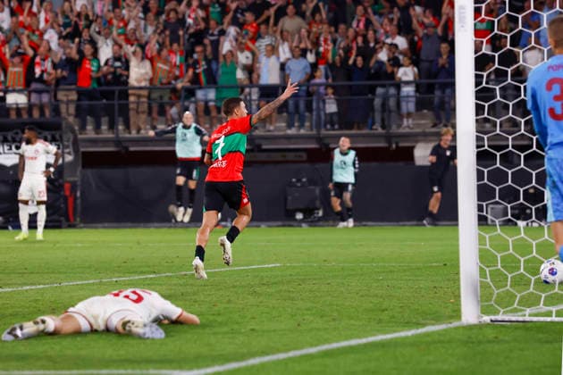 2026-08-11 NEC Nijmegen v Olympiacos - Champions League qualifying phase NIJMEGEN, NETHERLANDS - AUGUST 11: Panagiotis Retsos of Olympiakos Piraeus, Emre Mor of NEC Nijmegen celebrates after scoring his teams second goal (2-1) during the Champions League qualifying phase match between NEC Nijmegen and Olympiacos at Goffertstadion on August 11, 2026 in Nijmegen, Netherlands. Nijmegen Goffertstadion Netherlands Content not available for redistribution in The Netherlands directly or indirectly through any third parties. Copyright: xBenxGalx