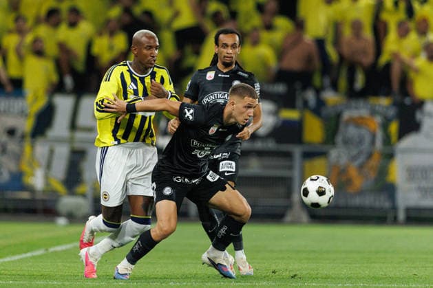 Talisca of Fenerbahce and Petar Petrovich of Sturm seen during UEFA Champions League third round qualifying game between teams of SK Sturm Graz and Fenerbahce SK (Maciej Rogowski Ball Raw Images) Graz Dalymount Park Austria Copyright: xMaciejxRogowskix sturmfenerbahce2627_1-100