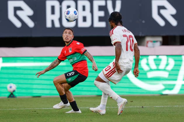 2026-08-11 NEC Nijmegen v Olympiacos - Champions League qualifying phase NIJMEGEN, NETHERLANDS - AUGUST 11: Emre Mor of NEC Nijmegen, Bruno Onyemaechi of Olympiakos Piraeus during the Champions League qualifying phase match between NEC Nijmegen and Olympiacos at Goffertstadion on August 11, 2026 in Nijmegen, Netherlands. Nijmegen Goffertstadion Netherlands Content not available for redistribution in The Netherlands directly or indirectly through any third parties. Copyright: xBenxGalx