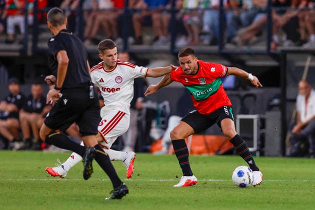 2026-08-11 NEC Nijmegen v Olympiacos - Champions League qualifying phase NIJMEGEN, NETHERLANDS - AUGUST 11: Christos Mouzakitis of Olympiakos Piraeus, Dusan Tadic of NEC Nijmegen during the Champions League qualifying phase match between NEC Nijmegen and Olympiacos at Goffertstadion on August 11, 2026 in Nijmegen, Netherlands. Nijmegen Goffertstadion Netherlands Content not available for redistribution in The Netherlands directly or indirectly through any third parties. Copyright: xBenxGalx