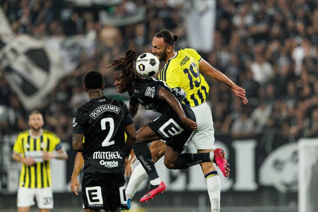 Vedat Muriqi of Fenerbahce and Ryan Fosso of Sturm seen during UEFA Champions League third round qualifying game between teams of SK Sturm Graz and Fenerbahce SK (Maciej Rogowski Ball Raw Images) Graz Dalymount Park Austria Copyright: xMaciejxRogowskix sturmfenerbahce2627_2-62