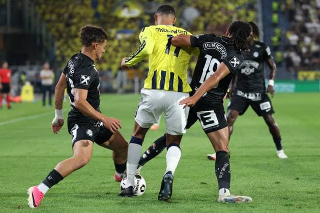 11 August 2026 - SOCCER - 2026 27 UEFA CHAMPIONS LEAGUE, Third Qualifying Round, 2nd Leg SK Sturm Graz vs Fenerbahce SK Jacob Hoedl (Sturm Graz) and Mason Greenwood (Fenerbahce) and Emran Soglo (Sturm Graz) in duel Graz Stadion Graz Liebenau Styria Austria Copyright: xYigitxOermex xPsxImagesxYigitxOermex xPsxImagesx