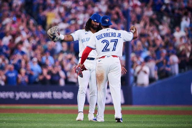 August 11, 2026, Toronto, On, Canada: Toronto Blue Jays Charles McAdoo (26) and Vladimir Guerrero Jr. (27) celebrate after their win against the Boston Red Sox during ninth inning MLB, Baseball Herren, USA baseball action in Toronto, on Tuesday, Aug. 11, 2026. Canada News - August 11, 2026  - ZUMAc35_ 20260811_zaf_c35_143 Copyright: xSammyxKoganx