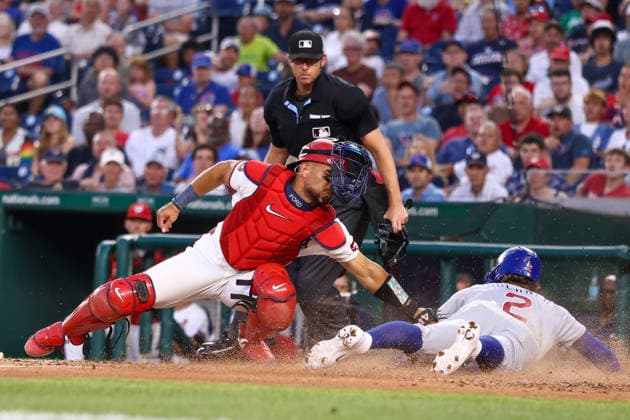 August 11, 2026, Washington D.C, District Of Columbia, United States: Washington, DC; Chicago Cubs second baseman Nico Hoerner (2) slides safely past the tag of Washington Nationals catcher Harry Ford (17) during the Major League Baseball game between the Washington Nationals and the Chicago Cubs at Nationals Park on Tuesday, August 11, 2026. The Cubs beat the Nationals 8-6. Washington D.C United States - ZUMAp258 20260811_znp_p258_026 Copyright: xStevexPrakopex