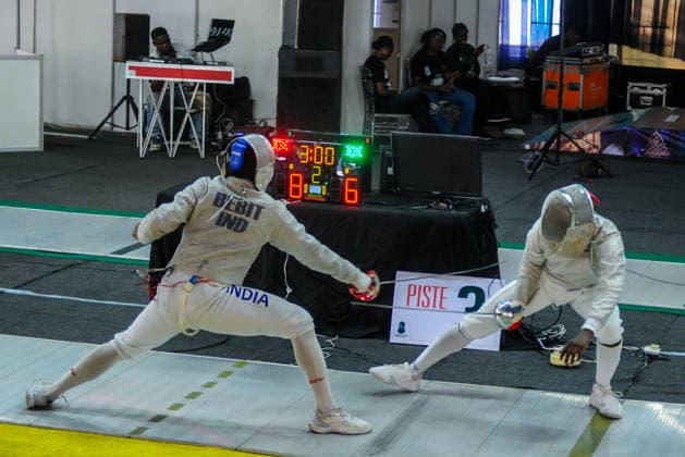 LAGOS, NIGERIA - AUGUST 11: Akinyosoye Oluwafolayemi, Nigeria and Bright Hentry Bebit, India during the 2026 Commonwealth Fencing Federation Championships - Senior Men s saber between Nigeria and India at Rugby School Eko Atlantic on August 11, 2026 in Lagos, Nigeria. Photo by Segun Ogunfeyitimi Copyright: xshengolpixsx