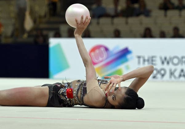 12.08.2026, xhbx, Rhythmische Sportgymnastik Weltmeisterschaft 2026, v.l. Qi Wang (China) (DFL DFB REGULATIONS PROHIBIT ANY USE OF PHOTOGRAPHS as IMAGE SEQUENCES and or QUASI-VIDEO) Frankfurt am Main *** August 12, 2026, xhbx, 2026 Rhythmic Gymnastics World Championships, from left: Qi Wang, China; DFL; DFB. REGULATIONS PROHIBIT ANY USE OF PHOTOGRAPHS AS IMAGE SEQUENCES AND OR QUASI-VIDEO. Frankfurt am Main