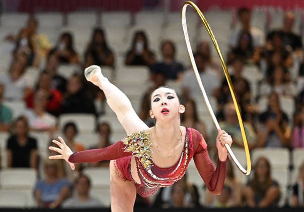 12.08.2026, xhbx, Rhythmische Sportgymnastik Weltmeisterschaft 2026, v.l. Qi Wang (China) Reifenübung (DFL DFB REGULATIONS PROHIBIT ANY USE OF PHOTOGRAPHS as IMAGE SEQUENCES and or QUASI-VIDEO) Frankfurt am Main *** August 12, 2026, xhbx, 2026 Rhythmic Gymnastics World Championships, from left: Qi Wang (China), hoop routine. DFL and DFB regulations prohibit any use of photographs as image sequences and or quasi-video. Frankfurt am Main