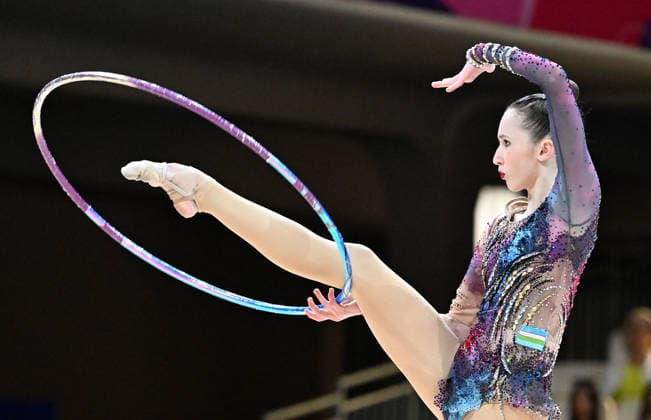 12.08.2026, xhbx, Rhythmische Sportgymnastik Weltmeisterschaft 2026, v.l. Takhmina Ikromova (Usbekistan) Reifenübung (DFL DFB REGULATIONS PROHIBIT ANY USE OF PHOTOGRAPHS as IMAGE SEQUENCES and or QUASI-VIDEO) Frankfurt am Main *** August 12, 2026, xhbx, 2026 Rhythmic Gymnastics World Championships, from left: Takhmina Ikromova, Uzbekistan, hoop routine. DFL and DFB regulations prohibit any use of photographs as image sequences and or quasi-video. Frankfurt am Main