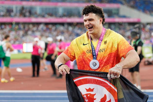 BIRMINGHAM, GREAT BRITAIN - AUGUST 11, 2026: Merlin HUMMEL (GER Germany) wins Silver in the hammer throw and uses the Eintracht Frankfurt flag for celebration during the European Athletics Championships at Alexander Stadium on August 11, 2026 in Birmingham, Great Britain. Great Britain Copyright: xAxelxKohringx