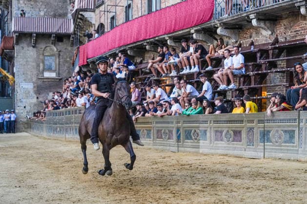 August 12, 2026, Siena, Toscana, Italy: The traditional night trials of the Palio di Siena, now called regulated trials, take place at dawn in Piazza del Campo and serve to evaluate the horses for the race. Siena, 12 08 2026 Palio Di Siena, The Regulated Trials At Dawn In Piazza Del Campo  - ZUMAa289 20260812_zia_a289_024 Copyright: xSalvatorexDexRosax xAgfx