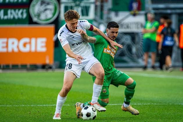 SOCCER - UEFA ECL, Rapid vs Paide VIENNA,AUSTRIA,12.AUG.26 - SOCCER - UEFA Conference League, qualification, SK Rapid Wien vs Paide Linnameeskond. Image shows Oskar Hoim (Paide) and Marco Tilio (Rapid).  GEPAxpictures xKevinxHackner