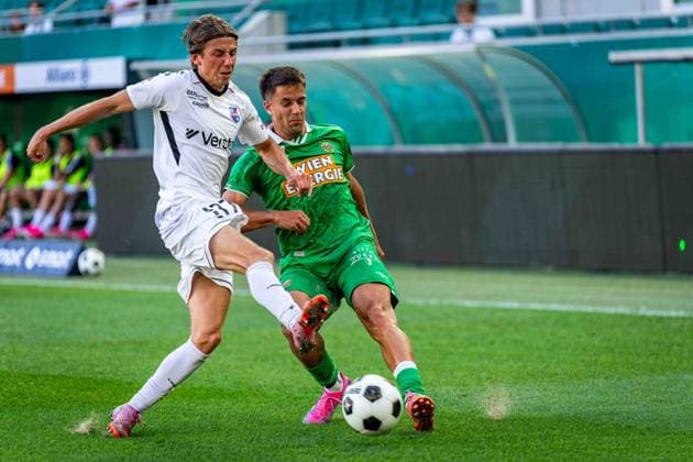 SOCCER - UEFA ECL, Rapid vs Paide VIENNA,AUSTRIA,12.AUG.26 - SOCCER - UEFA Conference League, qualification, SK Rapid Wien vs Paide Linnameeskond. Image shows Daniel Luts (Paide) and Jonas Auer (Rapid).  GEPAxpictures xKevinxHackner