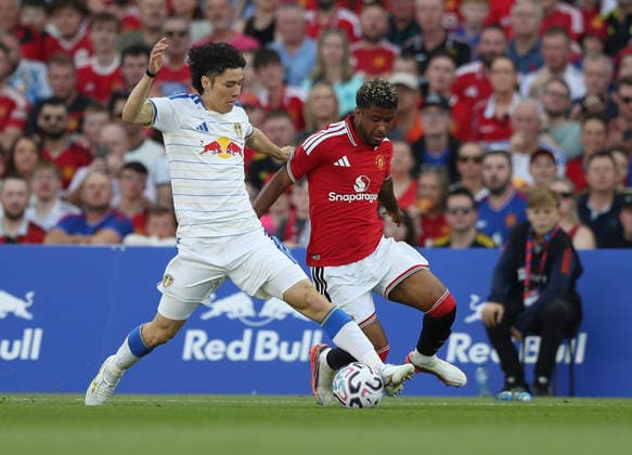 Football - 2026 2027 pre-season friendly - Manchester United, ManU vs. Leeds United - Croke Park, Dublin - Wednesday 12th August 2026 Manchester United s Andrey Santos in action against Leeds United s Ao Tanaka 