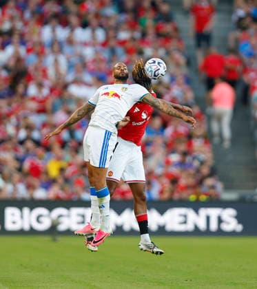 RECORD DATE NOT STATED 12th August 2026; Croke Park, Dublin, Ireland; Friendly Football, Manchester United, ManU versus Leeds United; Lukas Nmecha of Leeds United challenges for the ball with Leny Yoro of Manchester United PeterxFitzpatrick