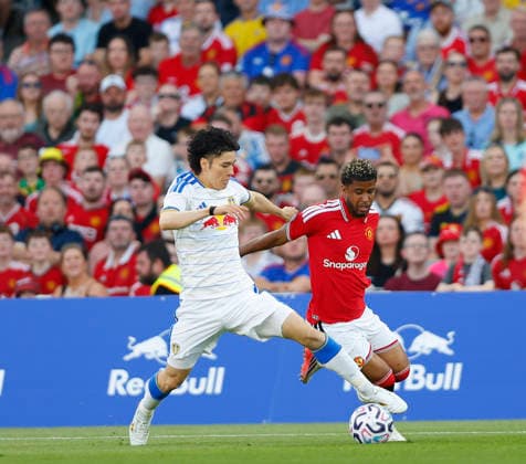 RECORD DATE NOT STATED 12th August 2026; Croke Park, Dublin, Ireland; Friendly Football, Manchester United, ManU versus Leeds United; Ao Tanaka of Leeds United challenges for the ball with Andrey Santos of Manchester United PeterxFitzpatrick