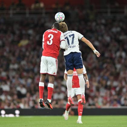 Christian Mosquera of Arsenal FC and Jesus Rodriguez of Como rise for the high ball during the Pre-season Friendly match between Arsenal and Como at the Emirates Stadium, London, England on 12 August 2026. Copyright: xPhilxHutchinsonx 45340044