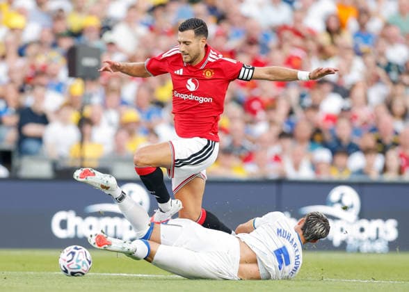 Dublin, Ireland, 12th August 2026. Tarik Muharemovic of Leeds United tackles Diogo Dalot of Manchester United, ManU during the Manchester United vs Leeds United Pre Season Friendly match at Croke Park, Dublin. Picture credit should read: Cody Froggatt Sportimage EDITORIAL USE ONLY. No use with unauthorised audio, video, data, fixture lists, club league logos or live services. Online in-match use limited to 120 images, no video emulation. No use in betting, games or single club league player publications. SPI_050_CF_MANCHESTER_UNITED_V_LEEDS SPI-4900-0050